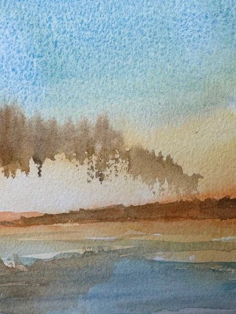 Atmospheric background detail with layered mist and blue sky