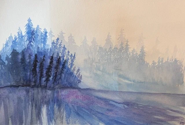 Watercolor painting of misty blue forest reflected on calm water under soft morning light.