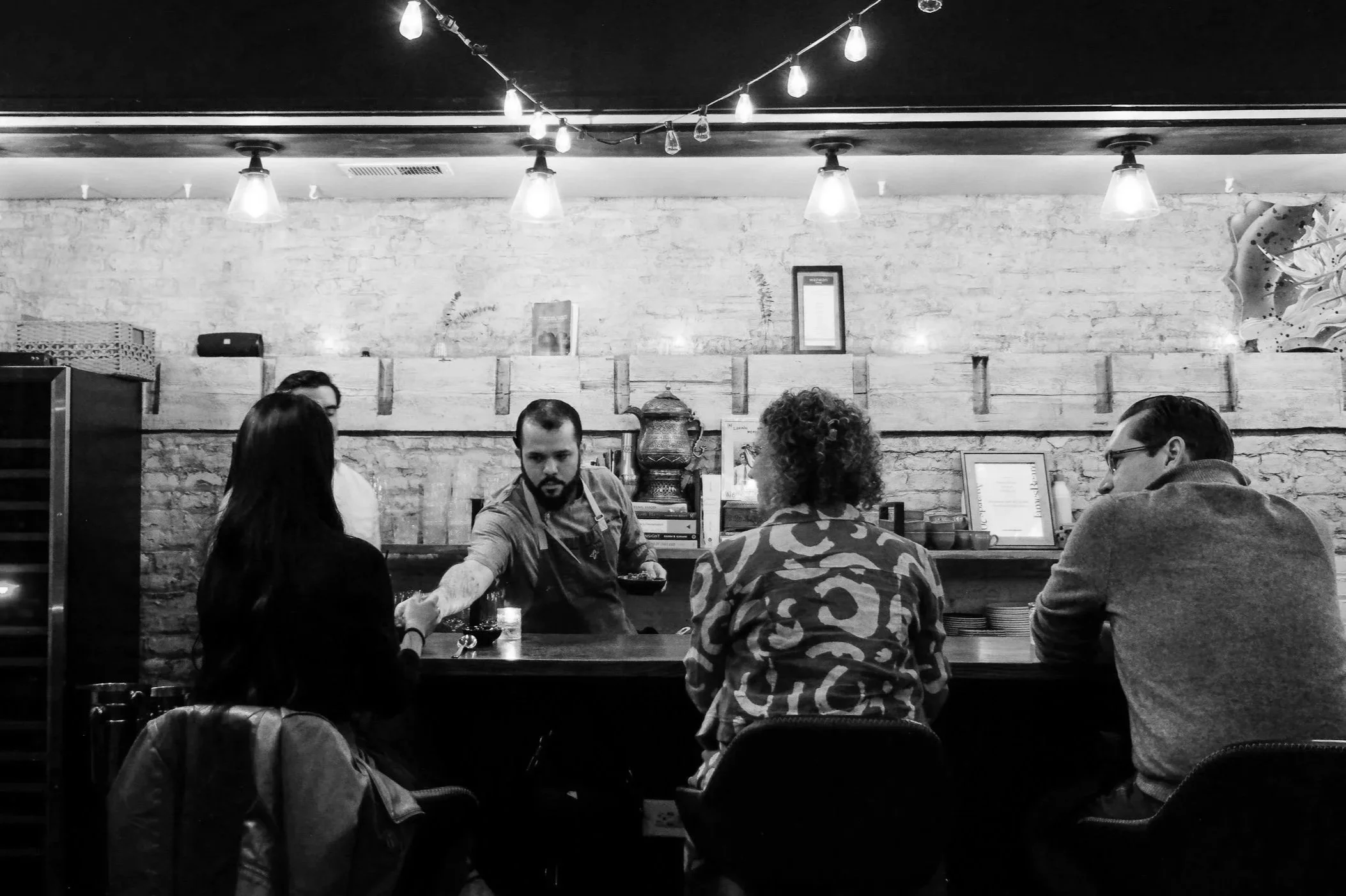 Chef justin serving guests at private event