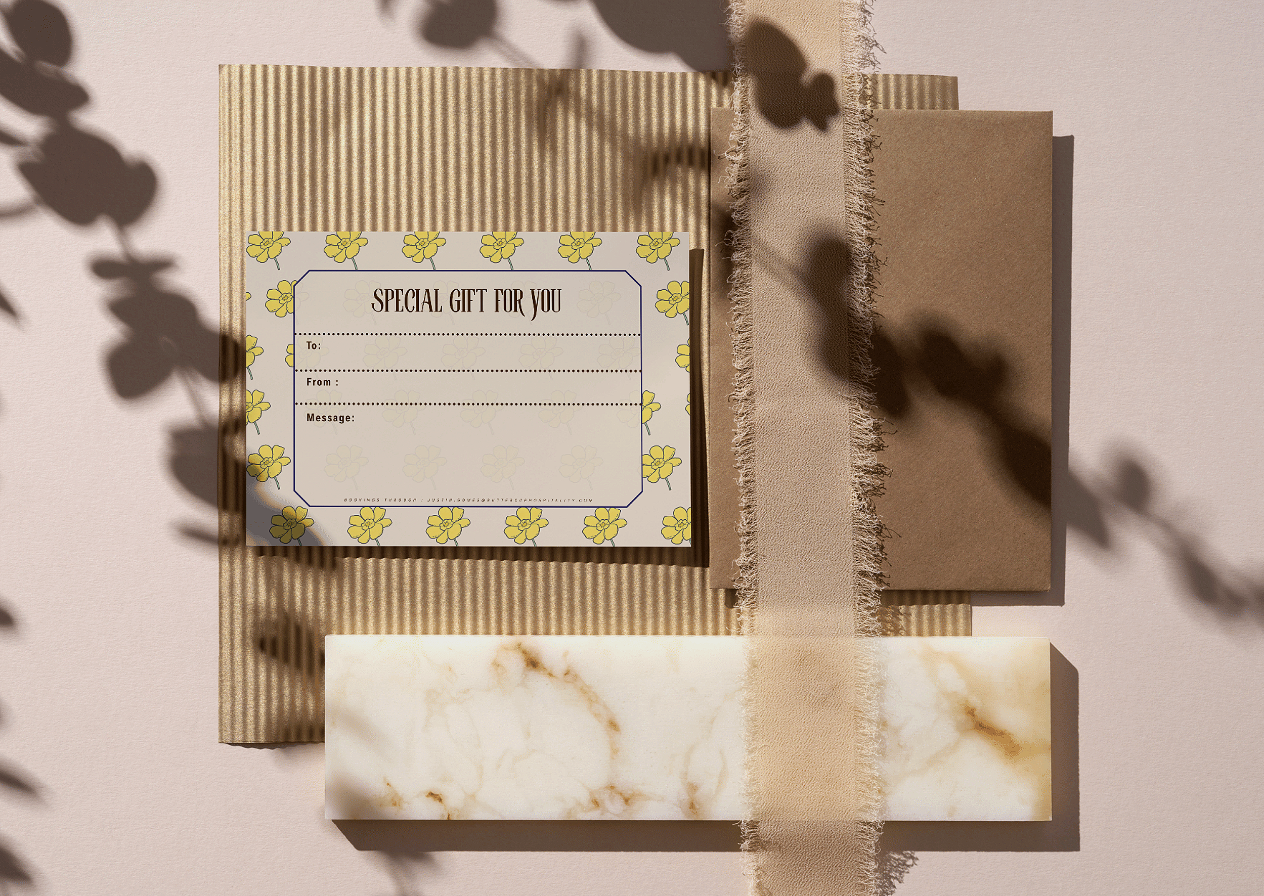 Several gift boxes and wrapping materials in neutral tones, with a gift card that reads "Special Gift For You" featuring yellow flowers.