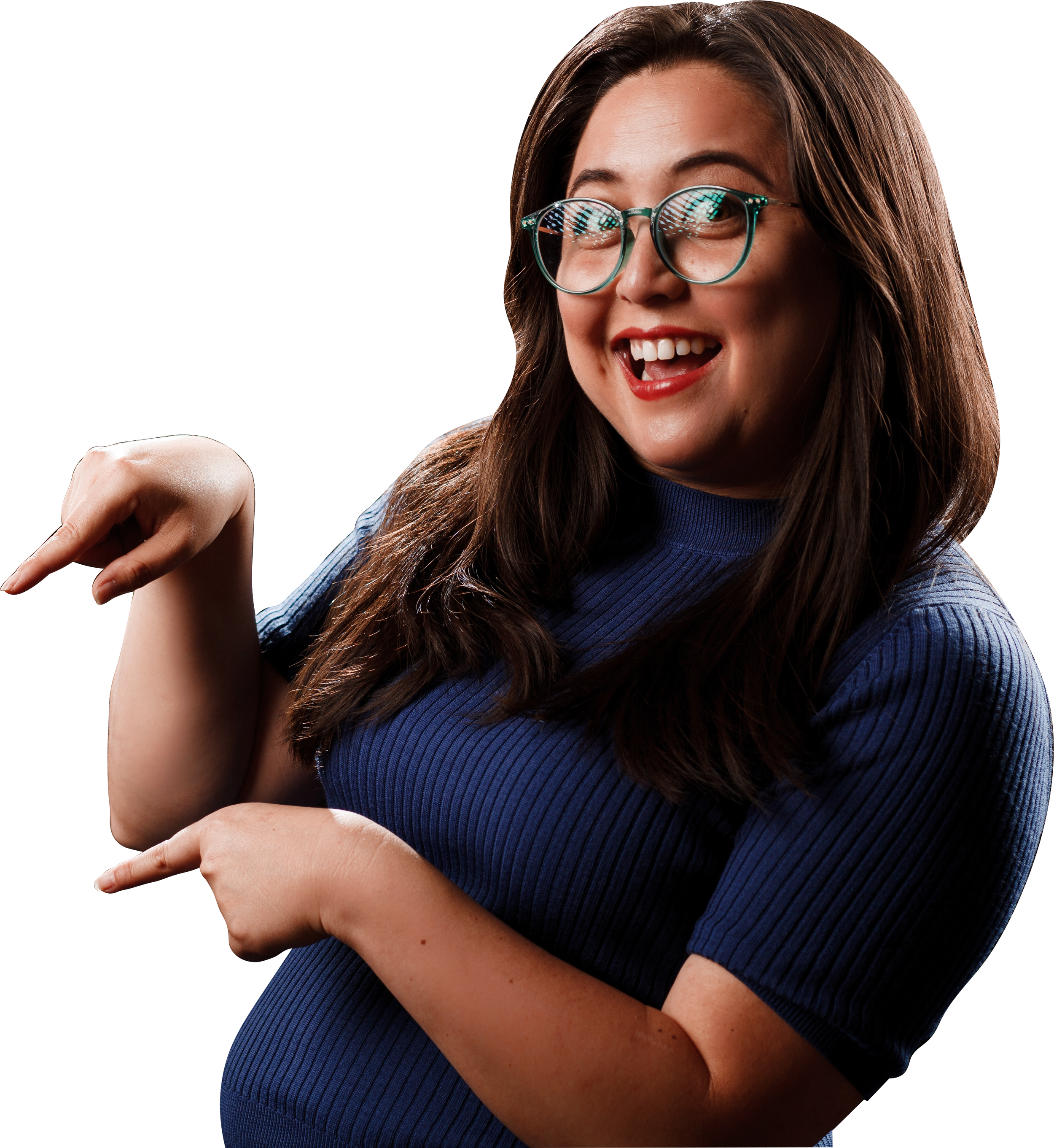 A woman with long brown hair, glasses, and red lipstick smiling, wearing a blue top, and pointing with her right and left hand.