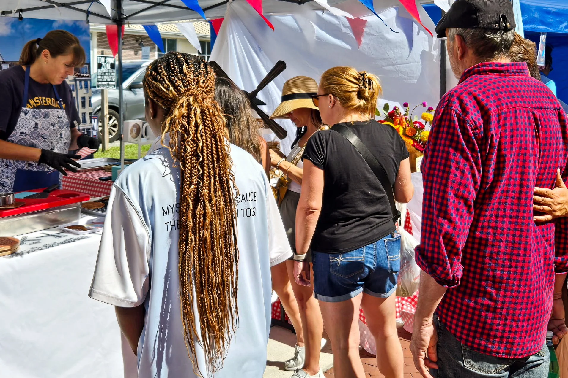 Guests enjoying a live stroopwafel baking experience at a public event