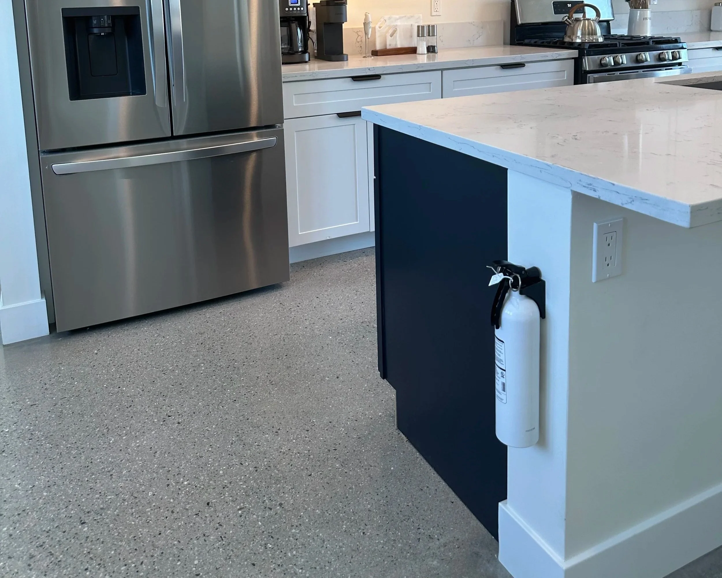 Kidde Fire Extinguisher located on the side of Kitchen Island
