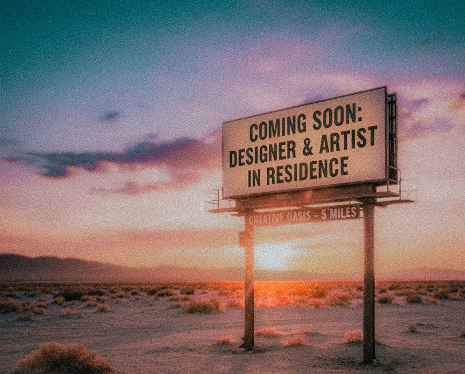 Billboard in desert at sunset announcing upcoming resident designer and artist event.