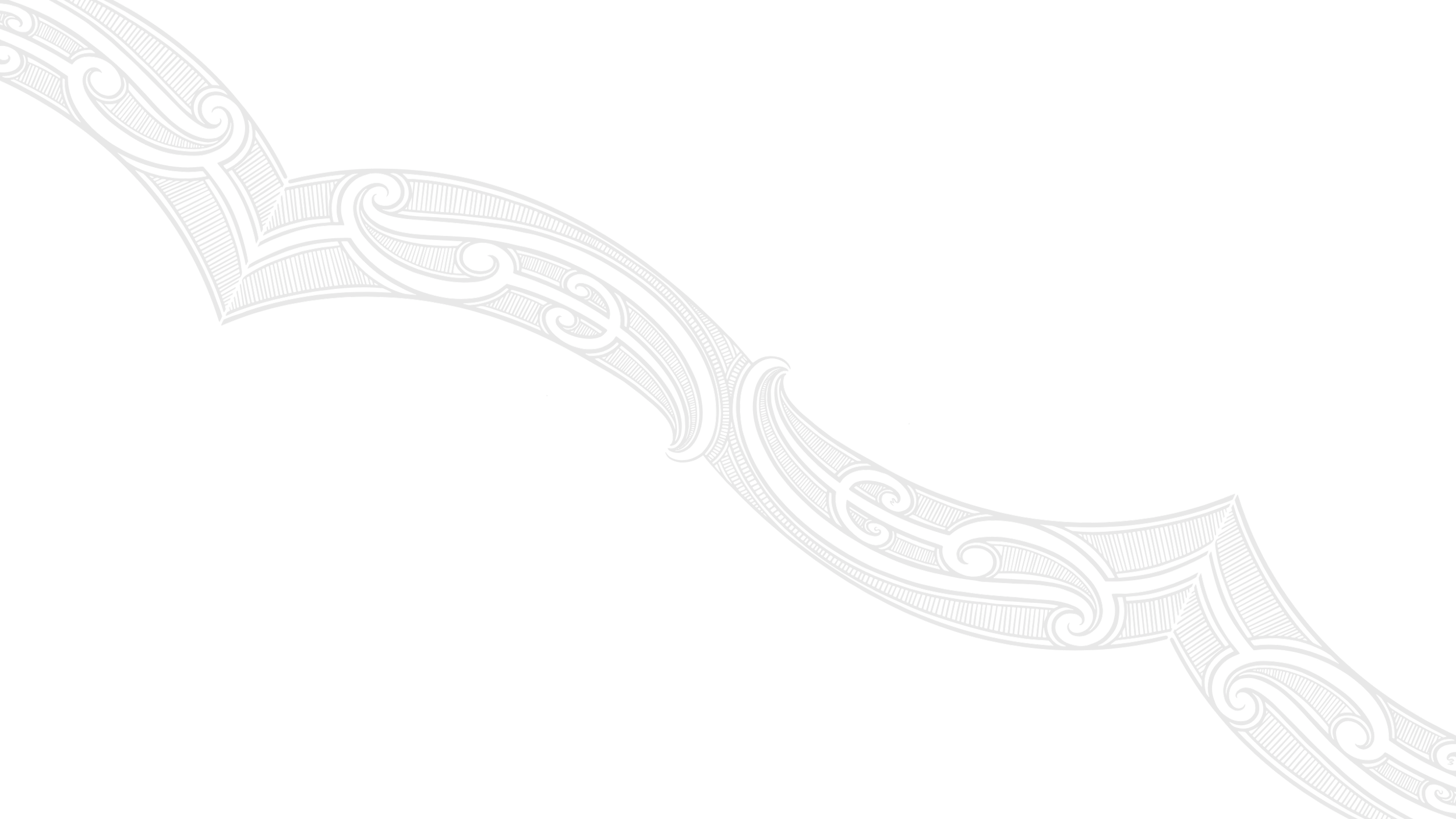 Decorative silver pattern on black background, curved with intricate scrollwork.