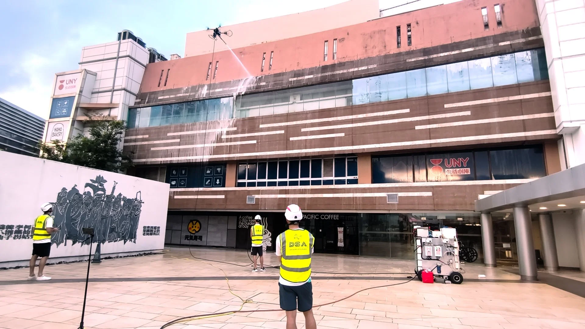 Drone façade cleaning operation at Lok Fu Place, Hong Kong, completed before shopping centre opening hours.