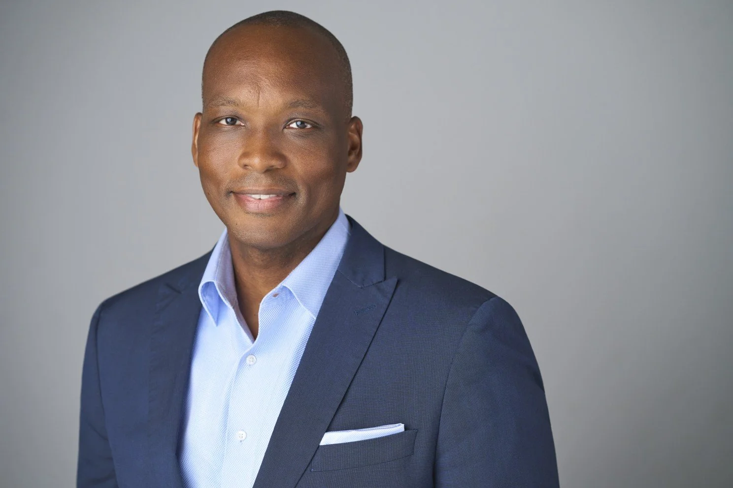 Headshot of Gregory Haile, CEO of Upwardly Global
