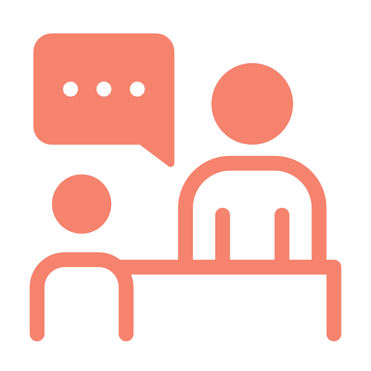 Illustration af to personer, en ved et bord, samt en taleboble med tre prikker, symboliserer samtale eller diskussion.