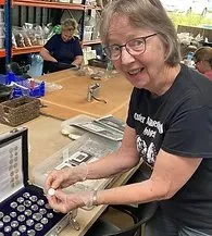 nancy with coin display_edited.jpeg