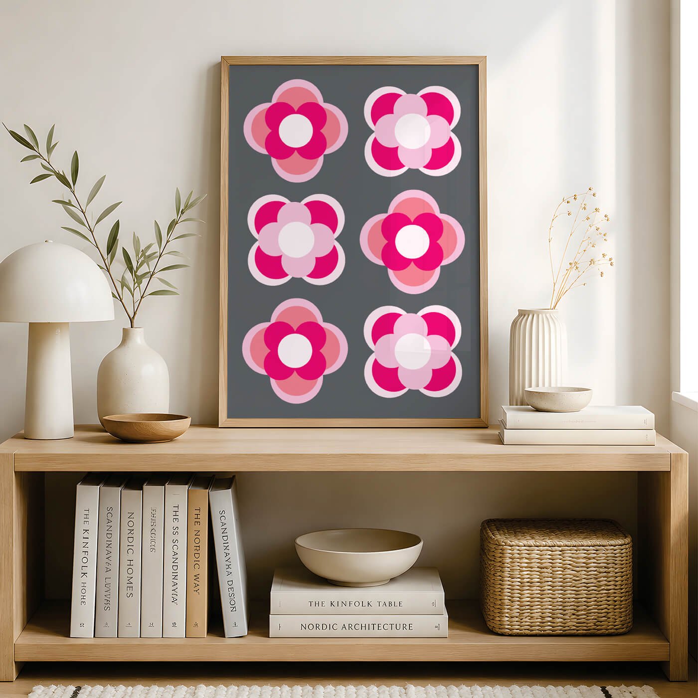 Pink contemporary flower print in a wooden frame displayed on a sideboard in a contemporary living room