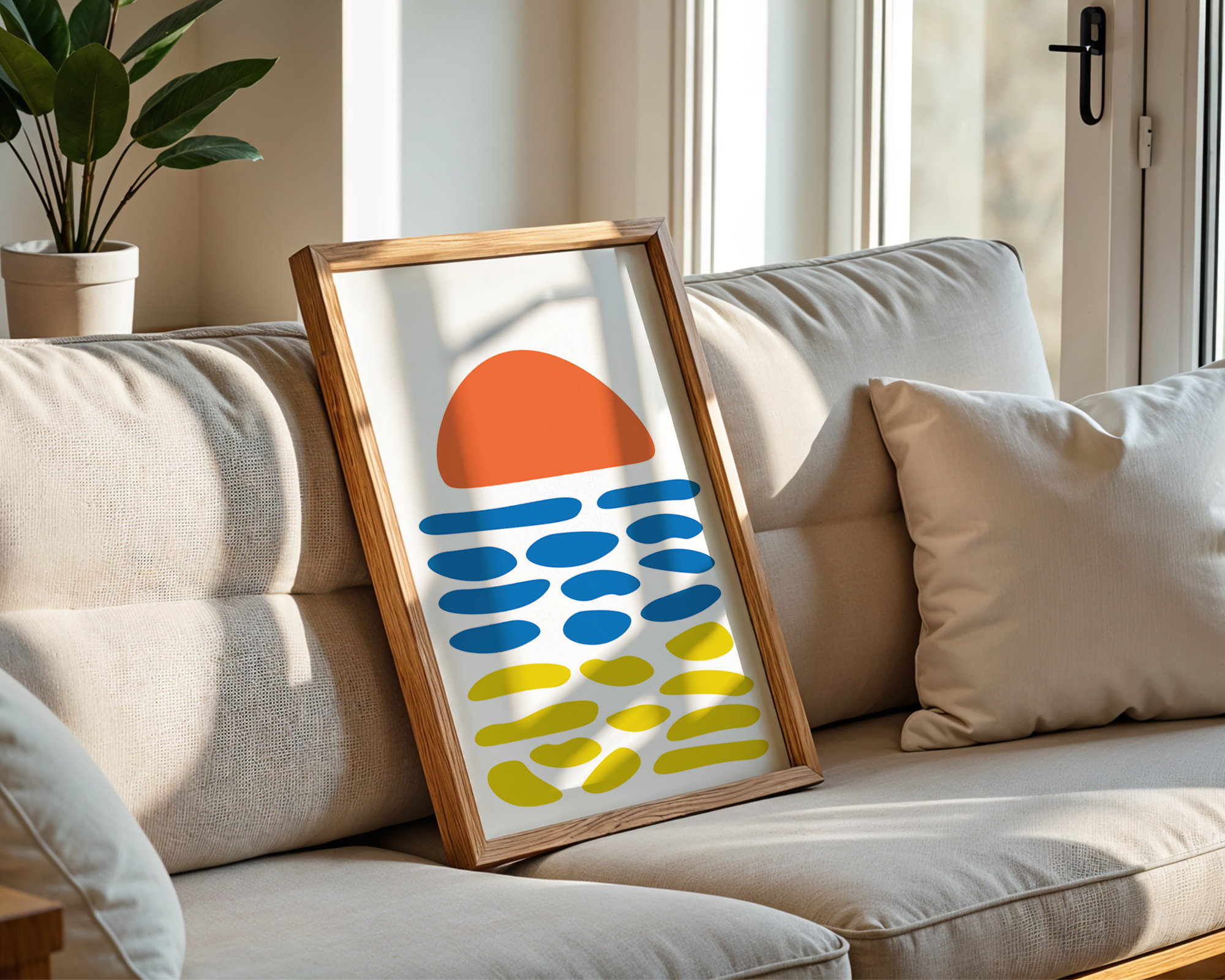 abstract beach print in frame on sofa