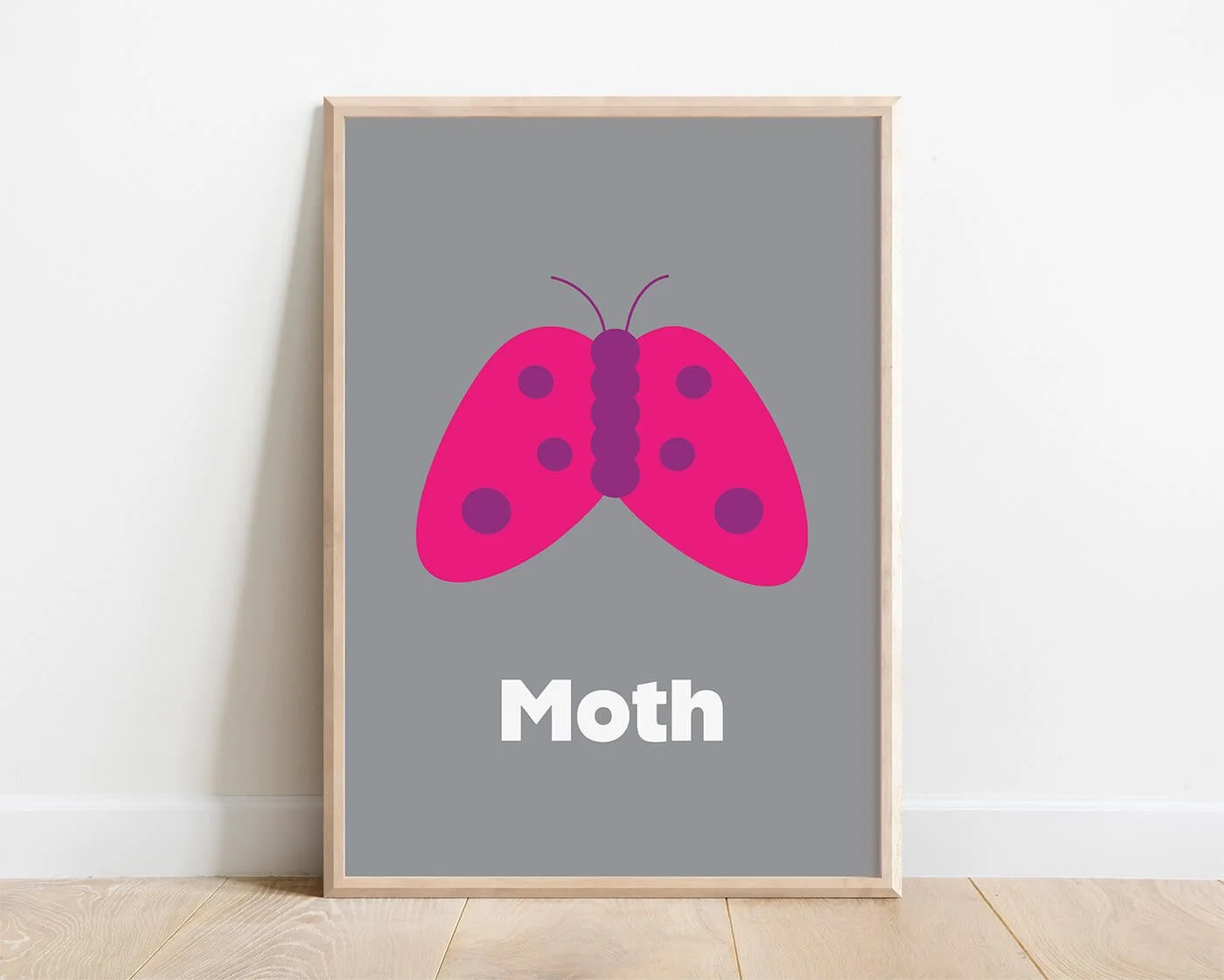Moth Learning Print in a modern oak wooden frame displayed on a white interior wall. Contemporary moth illustration on a soft grey background with the word "Moth" beneath