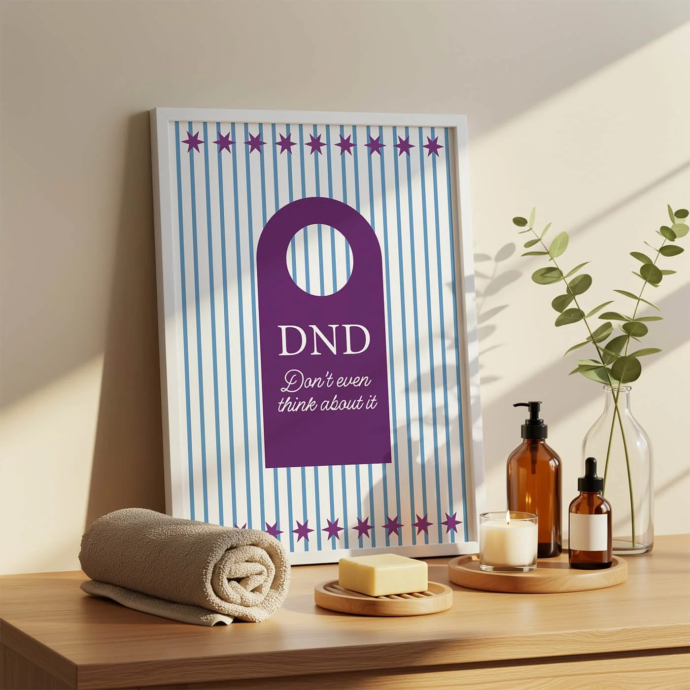 Framed art print with light blue vertical stripes and a purple hotel-style door hanger design that reads DND Don't even think about it.