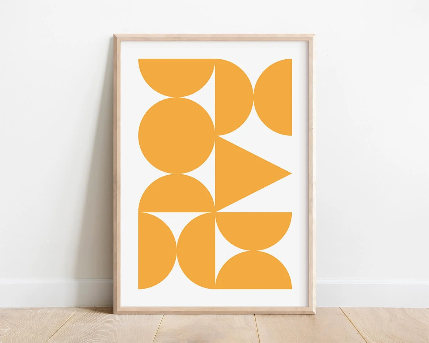 Yellow Abstract Forms Print in a modern oak wooden frame against a white background.