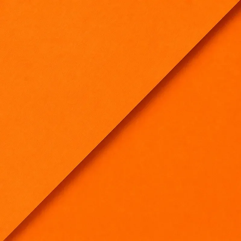 Close-up photo of an orange paper with a folded corner.