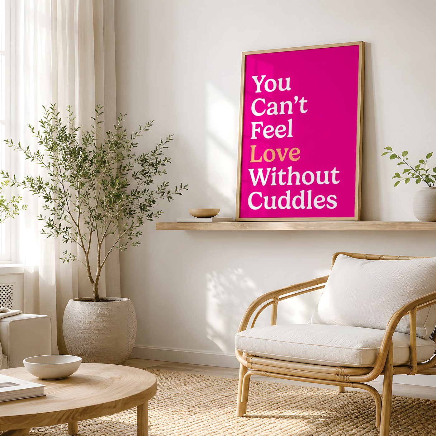 bright pink typography print displayed on wall above white chair in living room