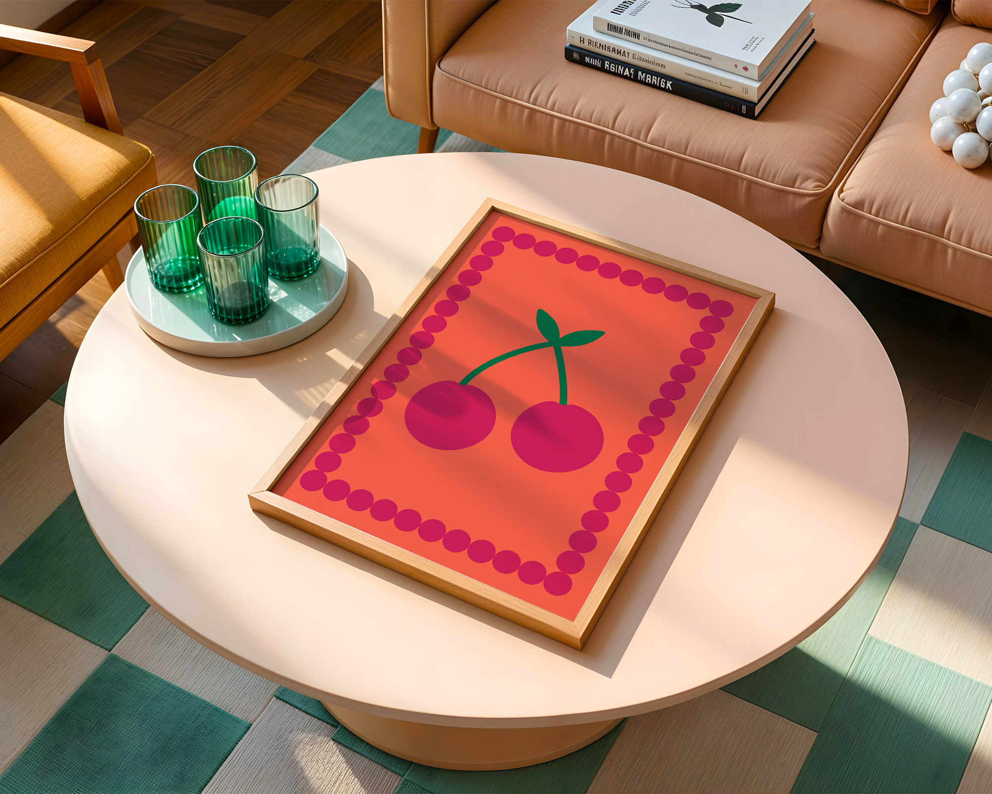 pretty orange poster on table with glasses on it next to sofa with a pile of books