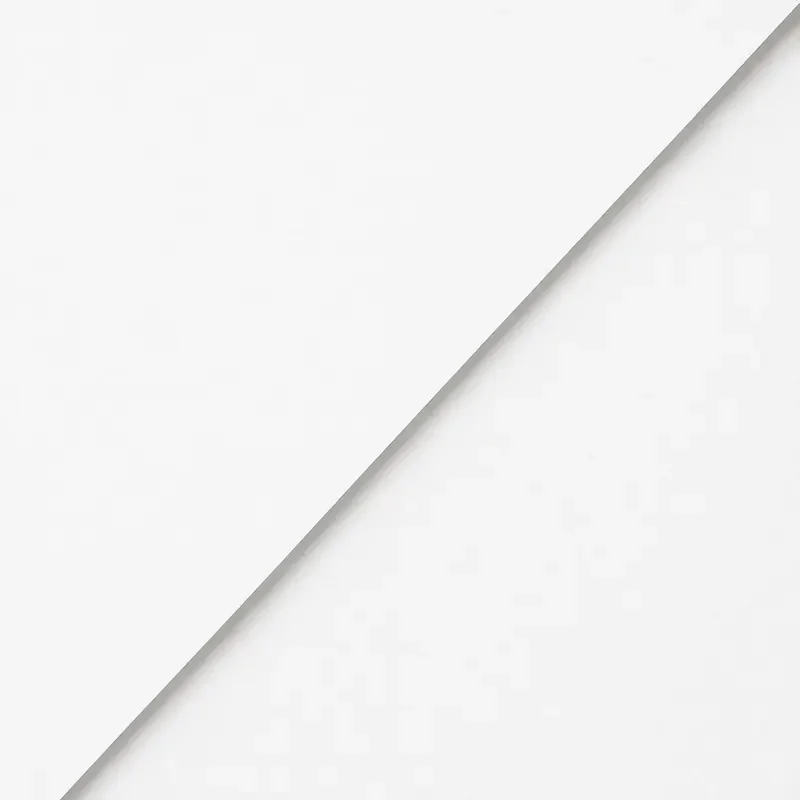 Close-up of overlapping white papers or surfaces with a clean, minimalistic look.