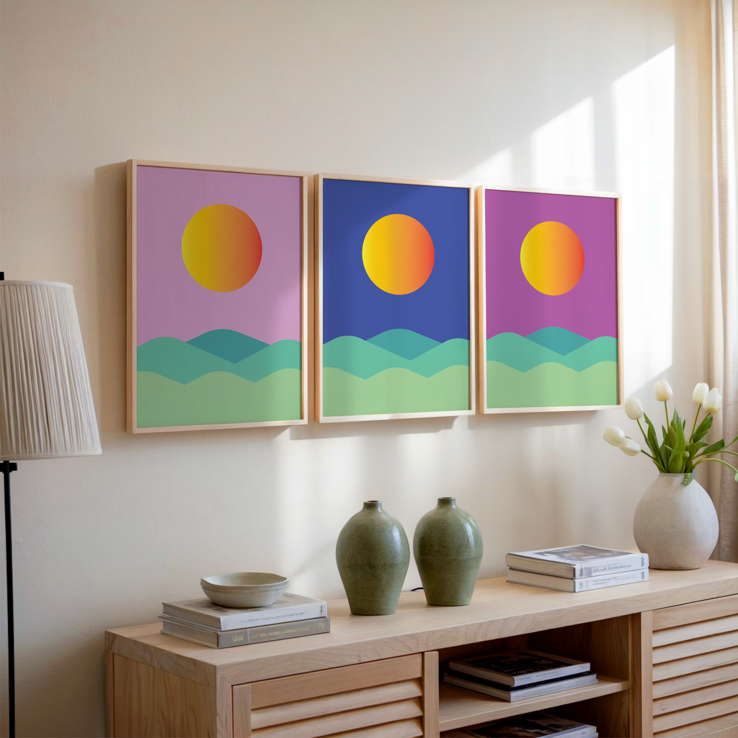 sun prints in wooden frames above wooden sideboard