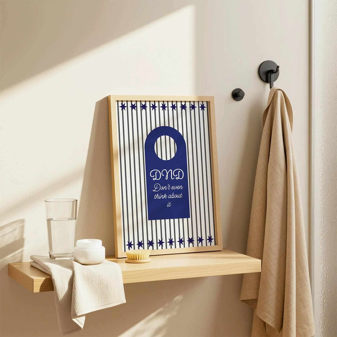 Blue Do Not Disturb Print displayed in a wooden frame on a contemporary bathroom shelf with modern décor