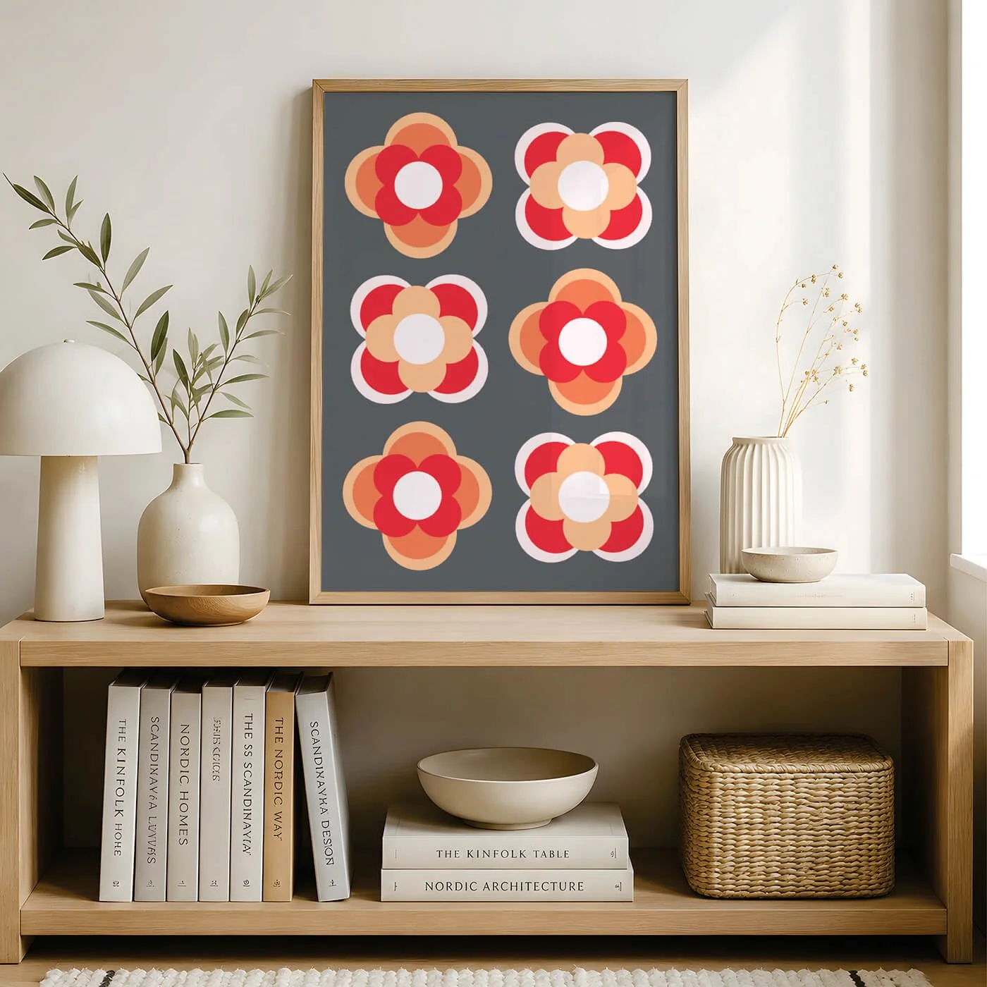 Orange contemporary flower print in a wooden frame above a beige chair in a modern living room