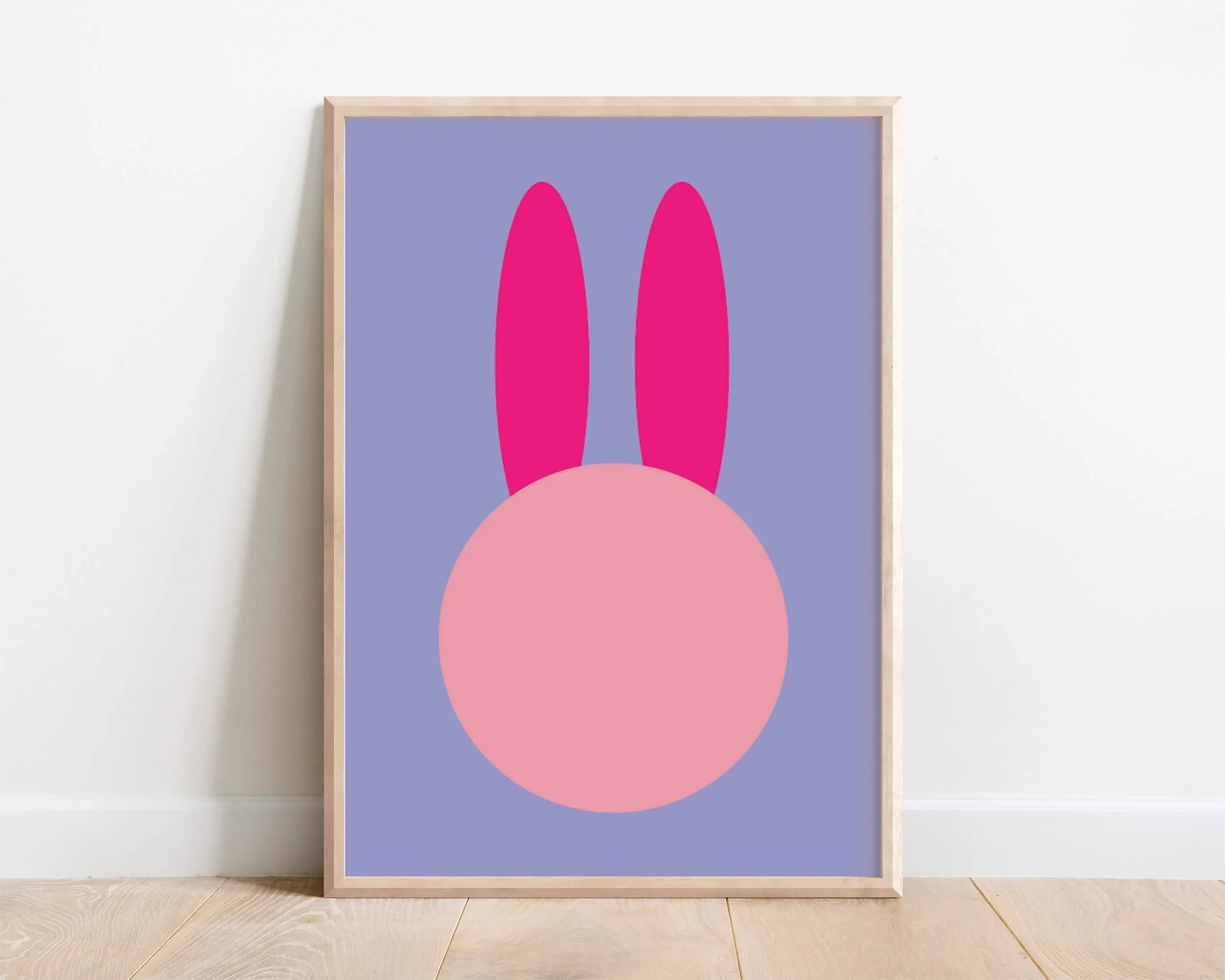 Framed abstract bunny wall art with large ears on a purple background – modern nursery or girls’ bedroom print, handmade in the UK.