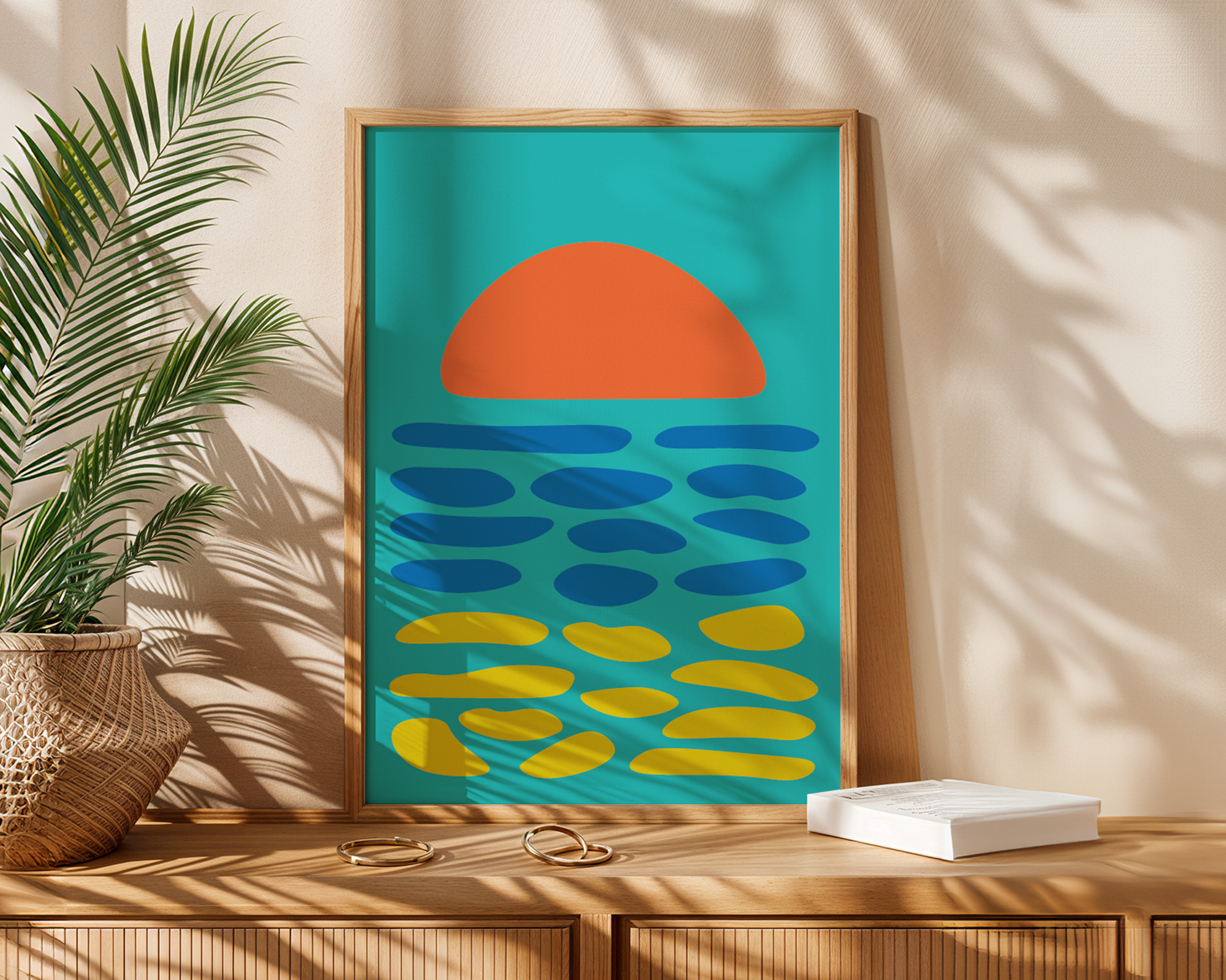 abstract sea print in frame next to plant