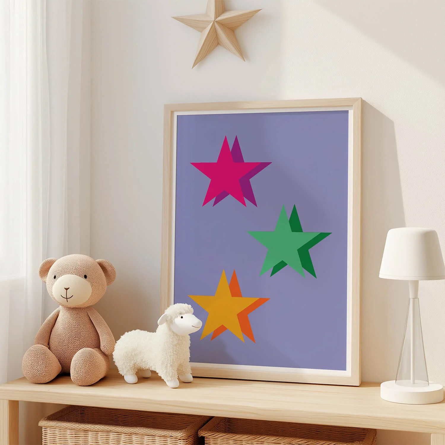 Colourful star wall art print displayed in a frame beside neutral children's decor in a modern nursery or kids' bedroom.