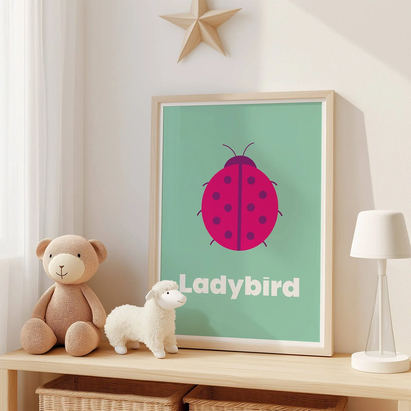 Ladybird Learning Print displayed in a modern oak frame on a shelf in a contemporary children's bedroom with two soft toys. Colourful ladybird wall art on a green background