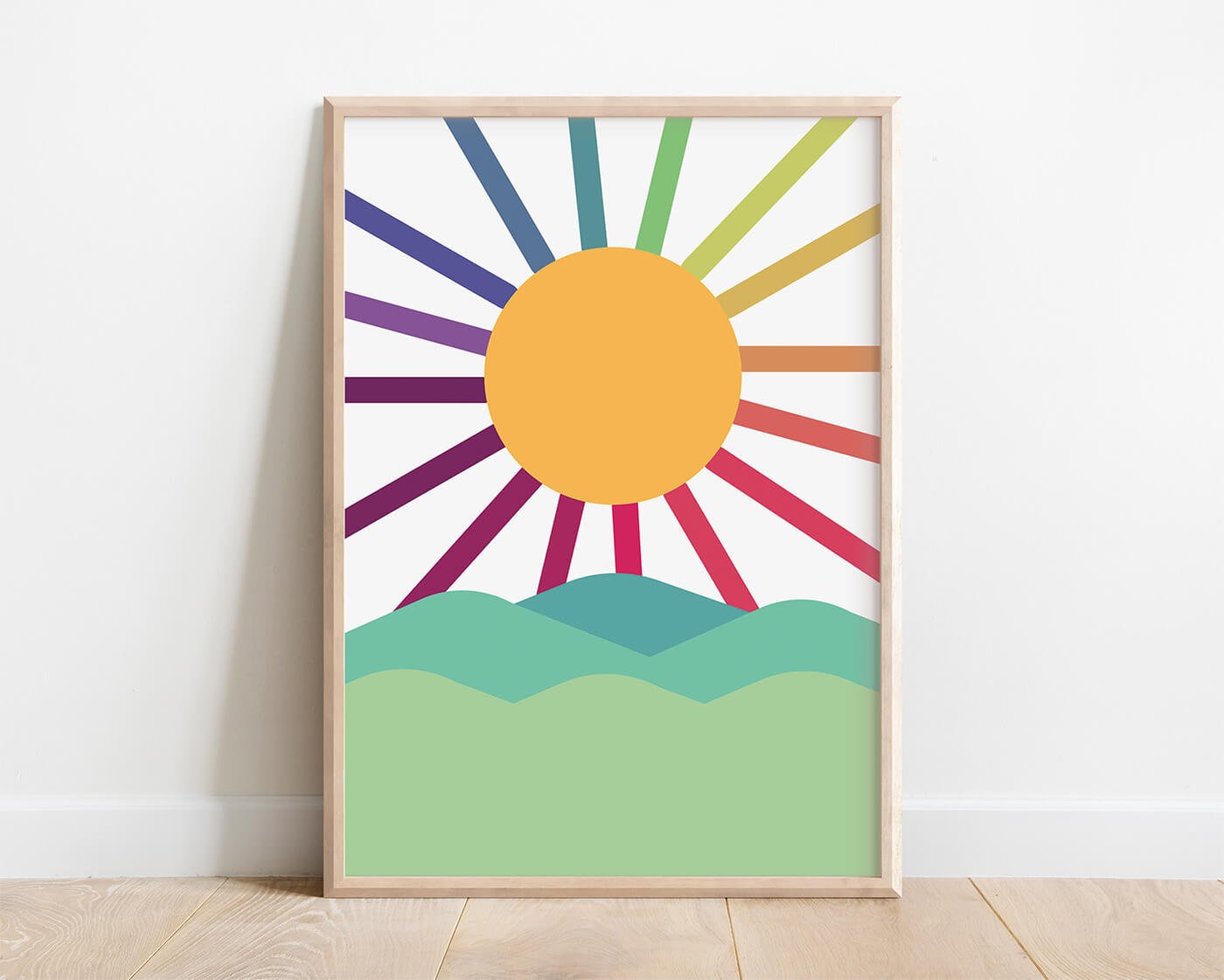 framed rainbow sun print featuring colourful strands of sunshine set against green hills