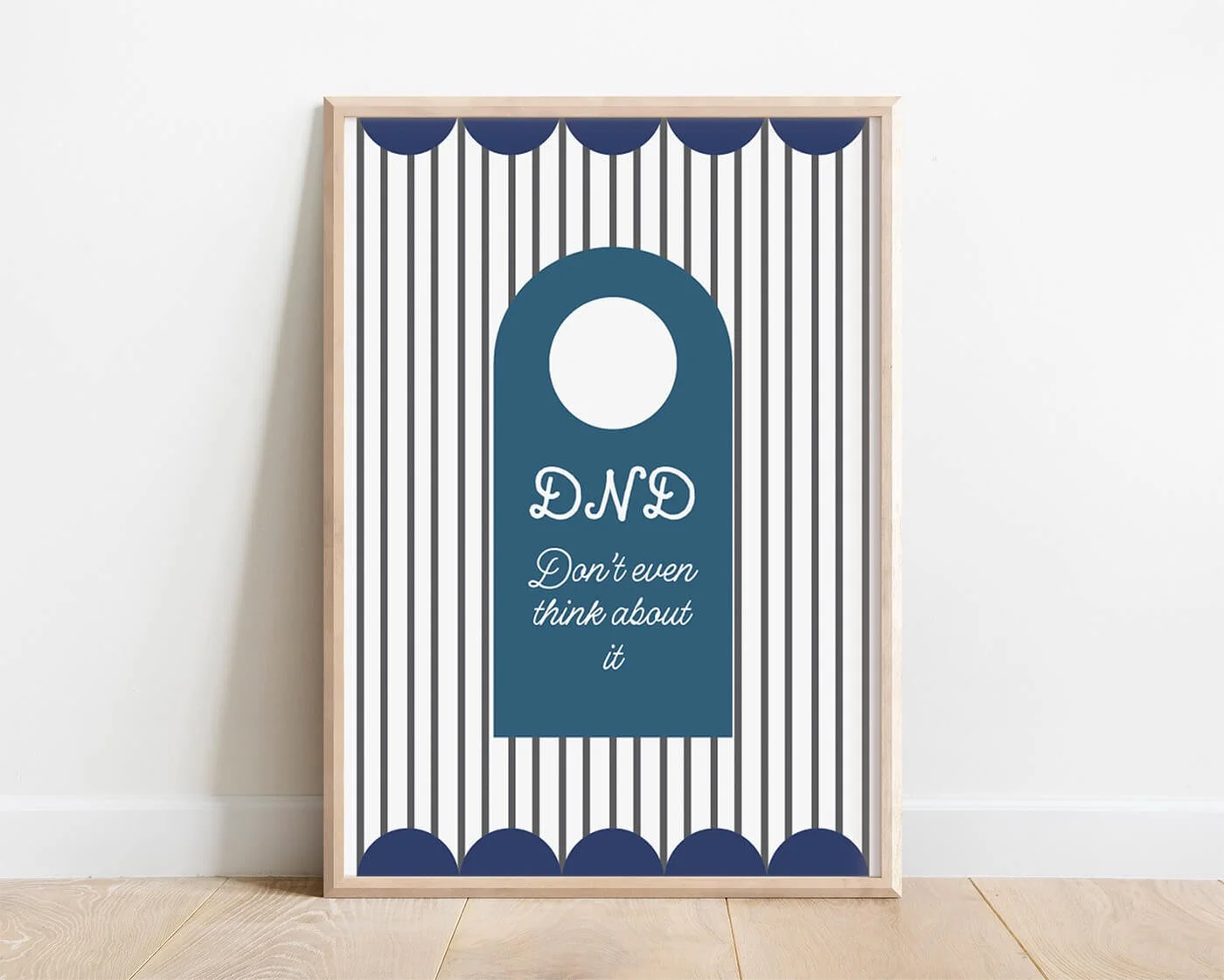 Blue Do Not Disturb Print presented in a contemporary wooden frame resting against a clean white wall.