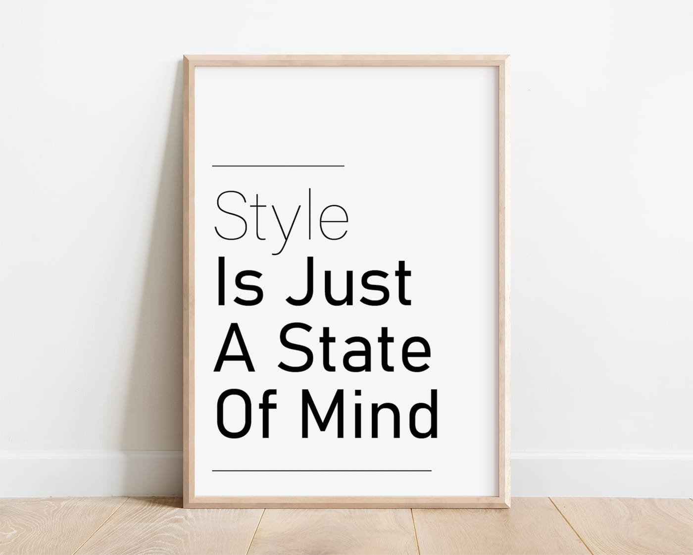 framed black and white stylish typography print against white wall