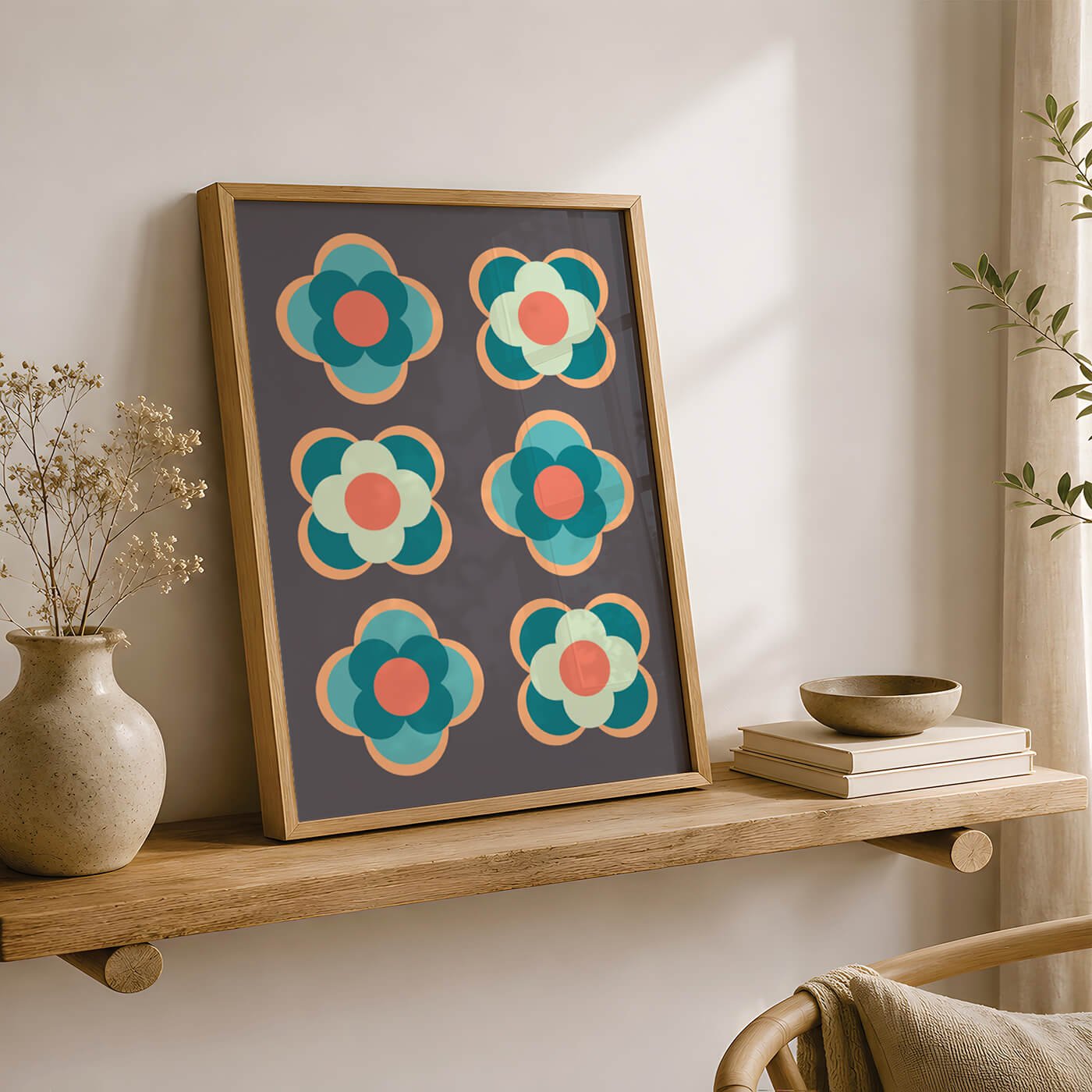 Contemporary flower print in a light wood frame on a wooden shelf