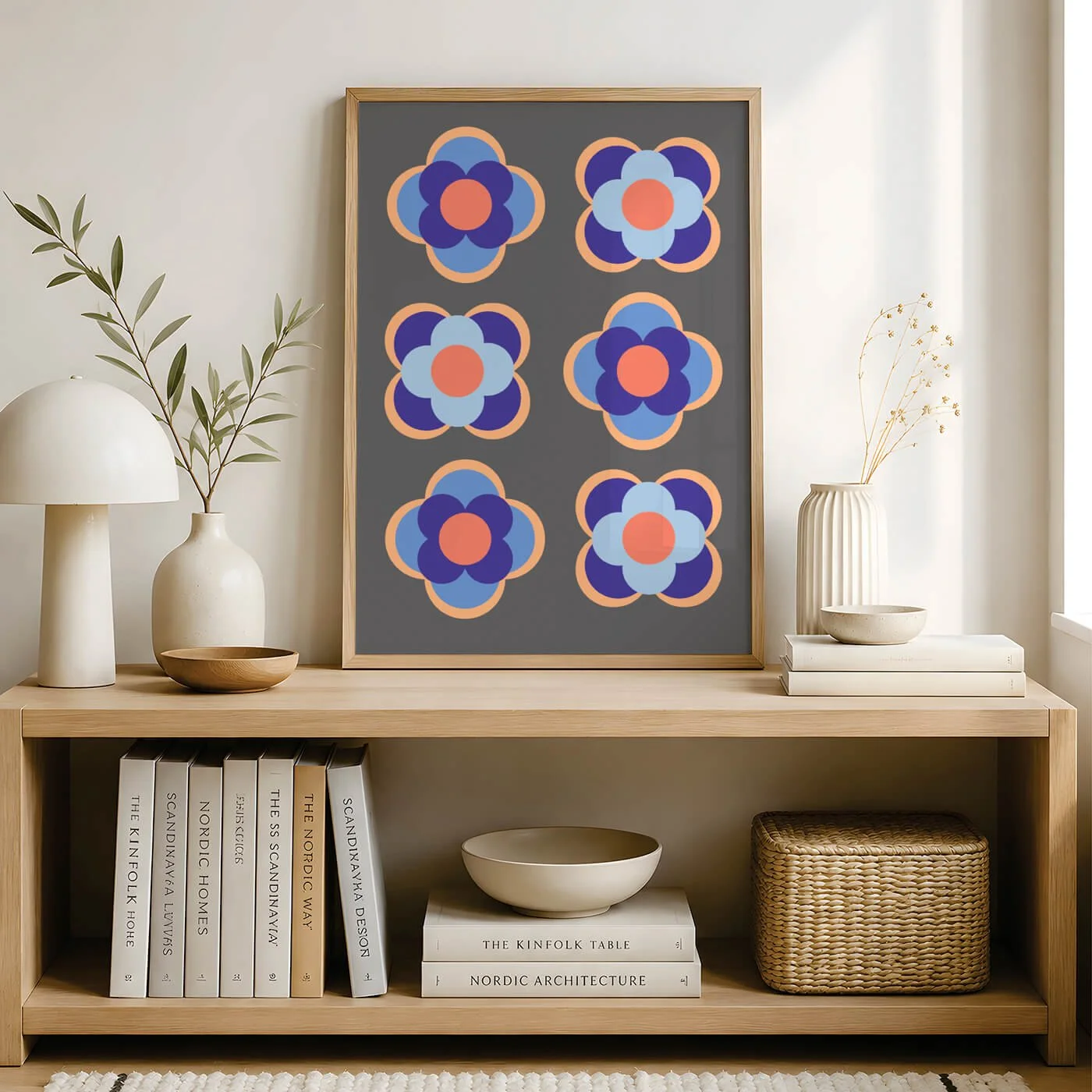 Contemporary blue geometric flower art print framed on an entryway console table, curated for a minimalist commercial interior