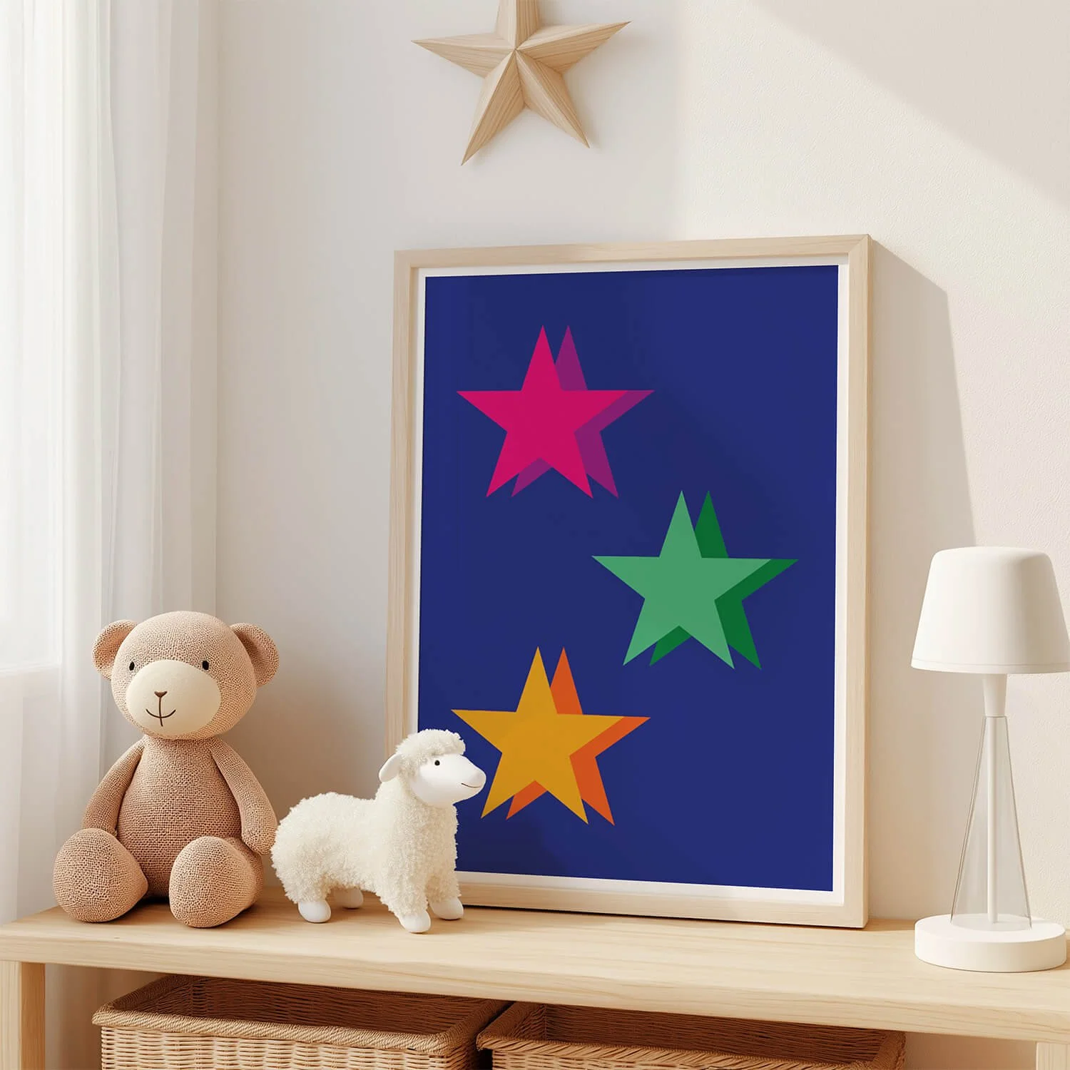 Cheerful kids’ star print with multicoloured stars in green, pink and yellow, displayed in a framed artwork against the wall in a colourful boys’ bedroom – UK children’s room decor