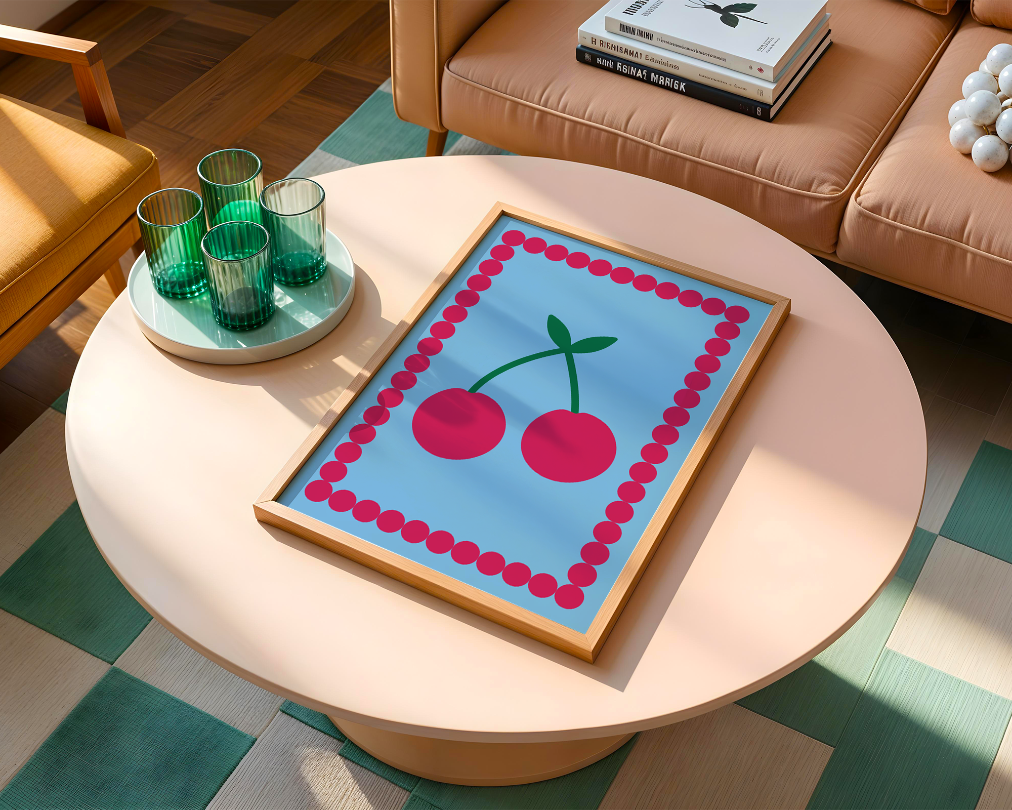colourful blue print of cherries on table next to sofa with books next to it