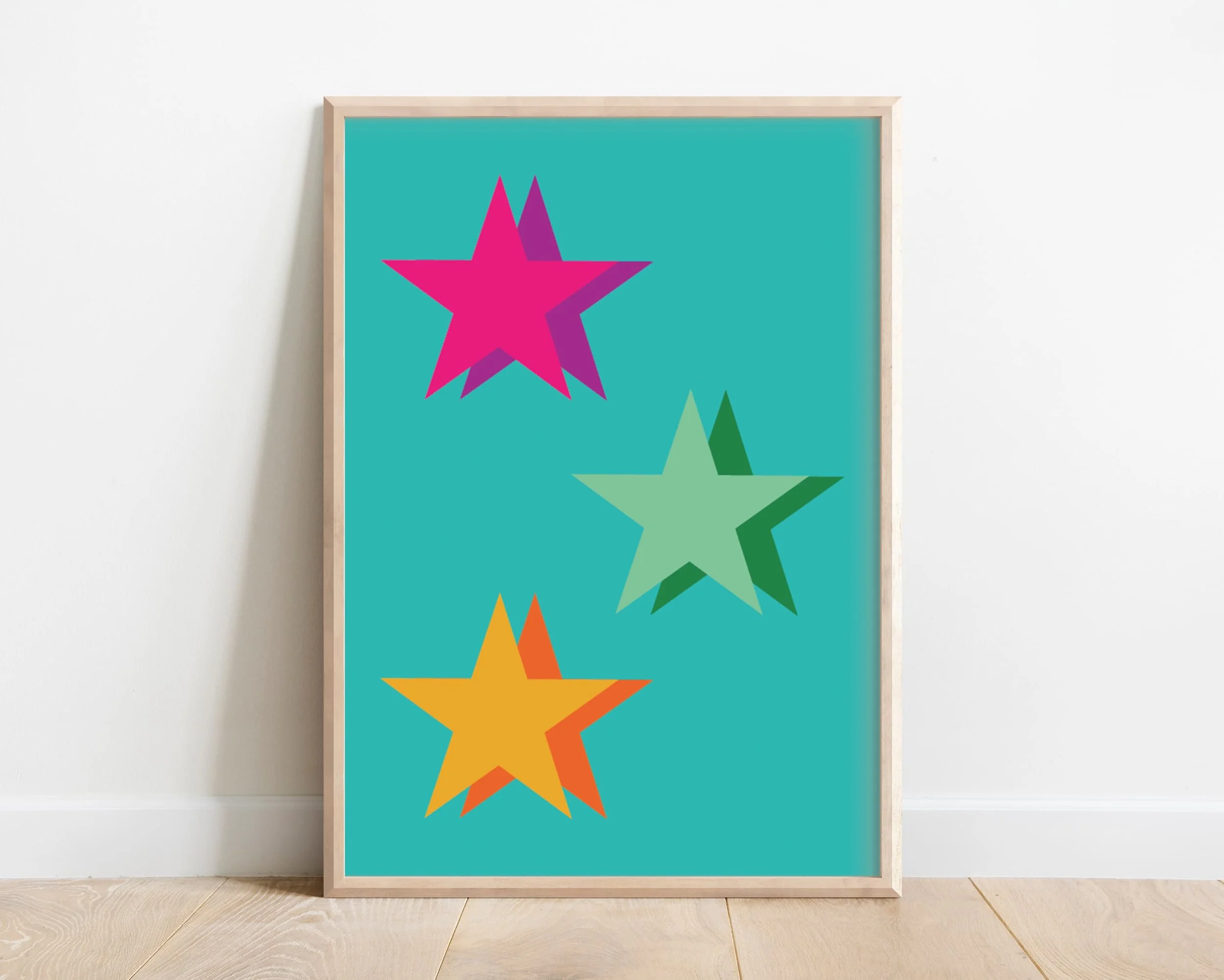 Bright kids wall art featuring multicoloured stars in pink and green tones, framed and displayed on a white background