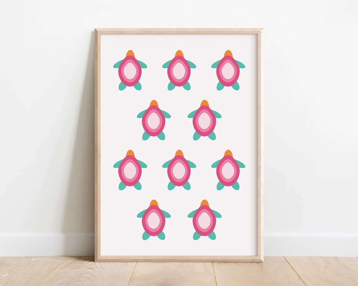 Pink baby turtle print featuring abstract turtle illustrations in soft blush tones displayed in a natural wooden frame, modern coastal wall art for contemporary interiors