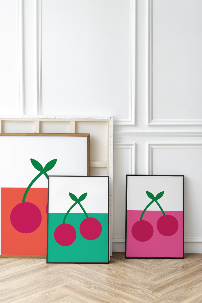 colourful cherry prints resting against wall