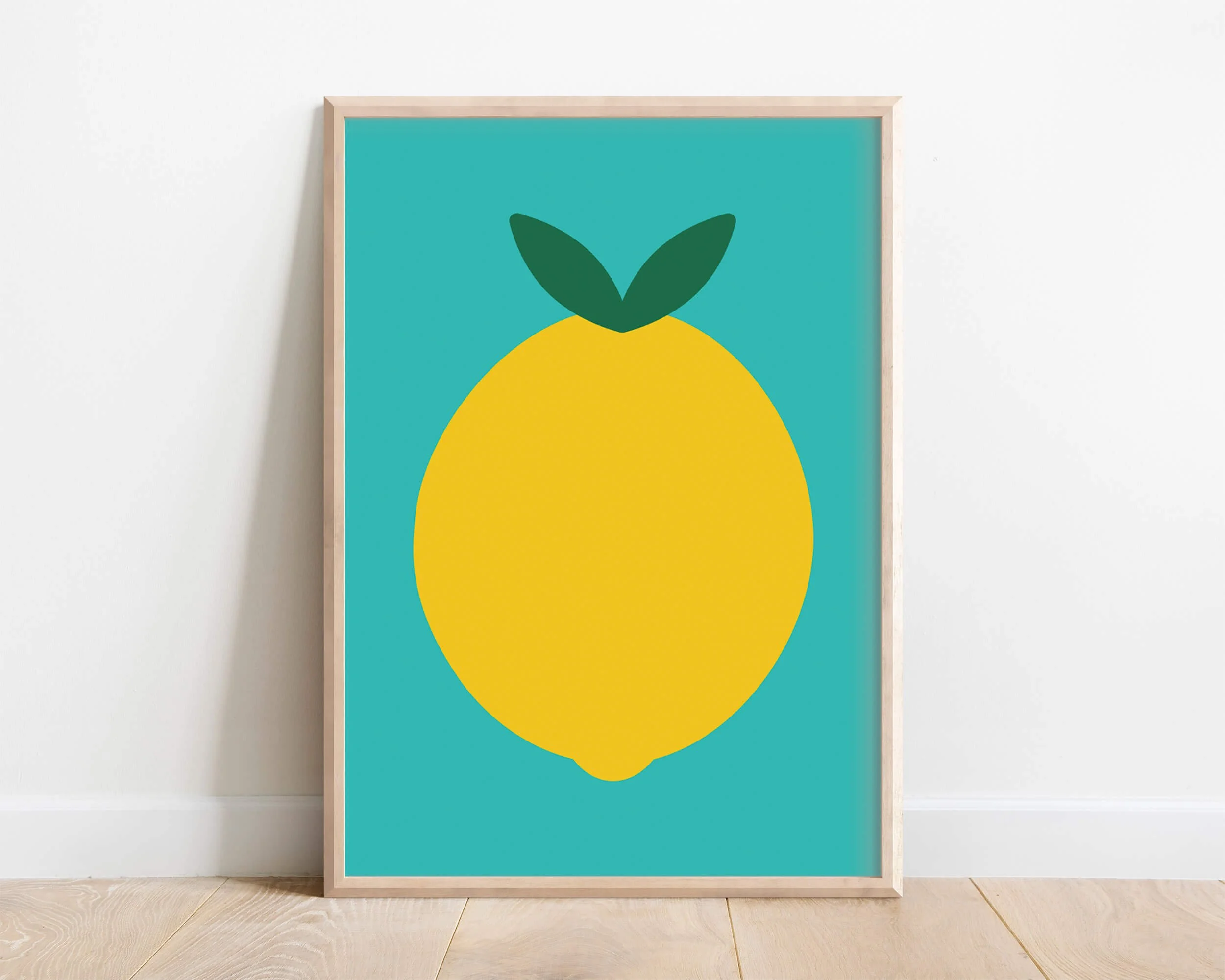 colourful green lemon print resting against white wall