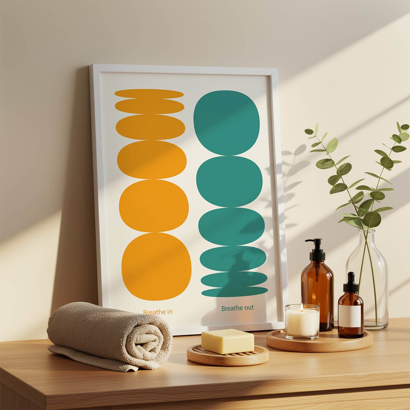 Framed “breathe in” mindfulness wall art displayed in bathroom next to stacked towels and cosmetics