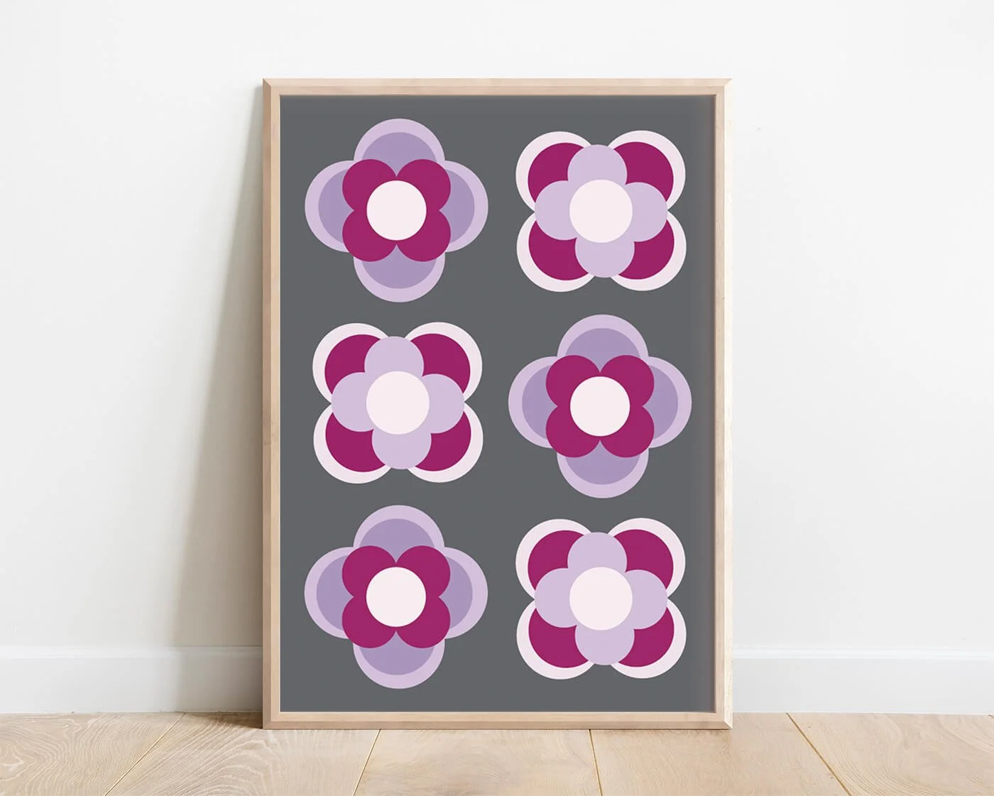 Purple contemporary flower print in a light wooden frame against a white background