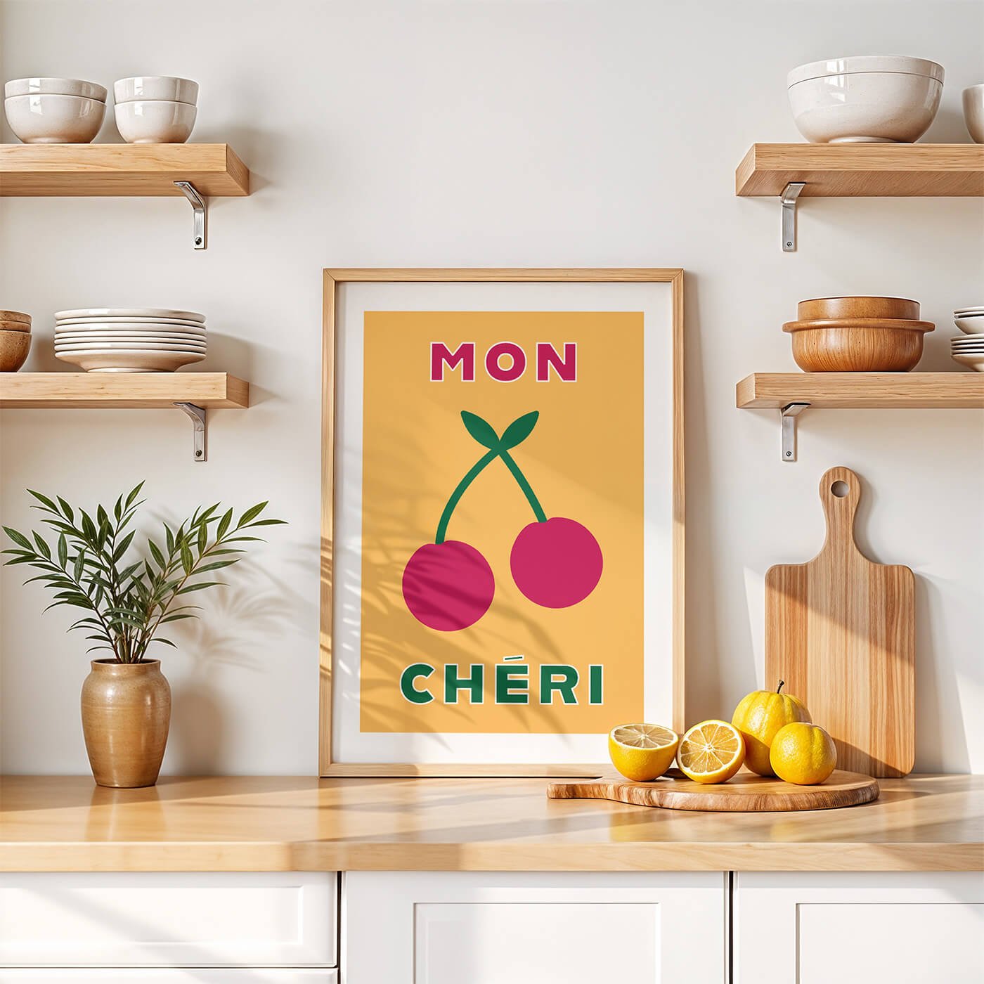Yellow Mon Cheri typography art print by Amatus in a wooden frame on a modern kitchen wall