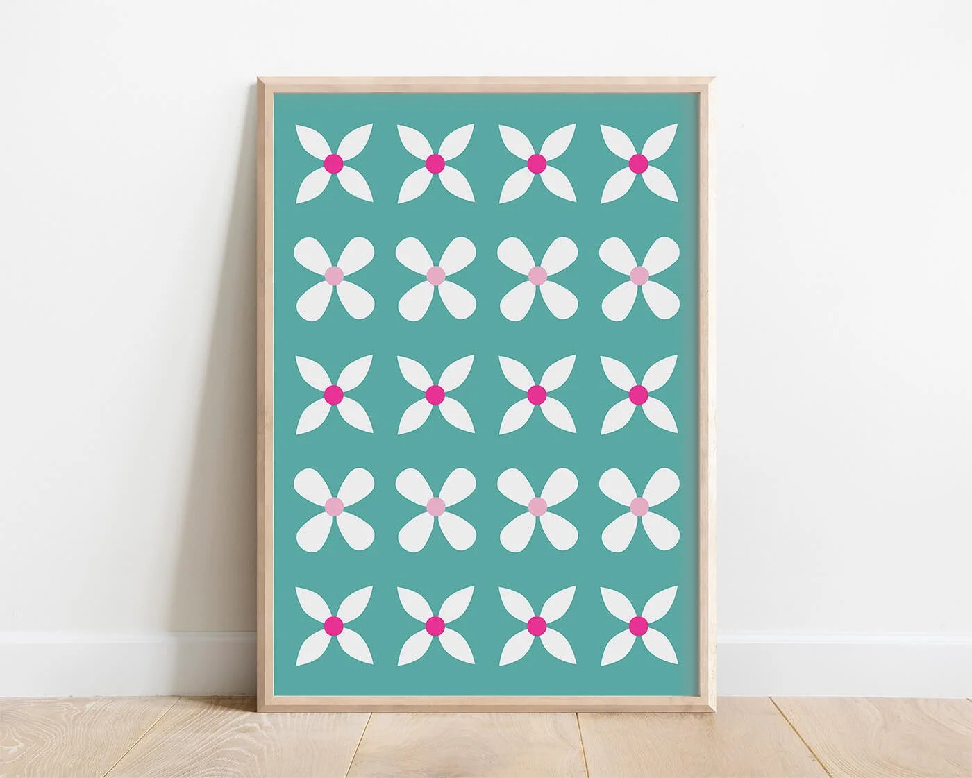 Green Abstract Flowers Print in a natural wooden frame displayed on a white interior wall