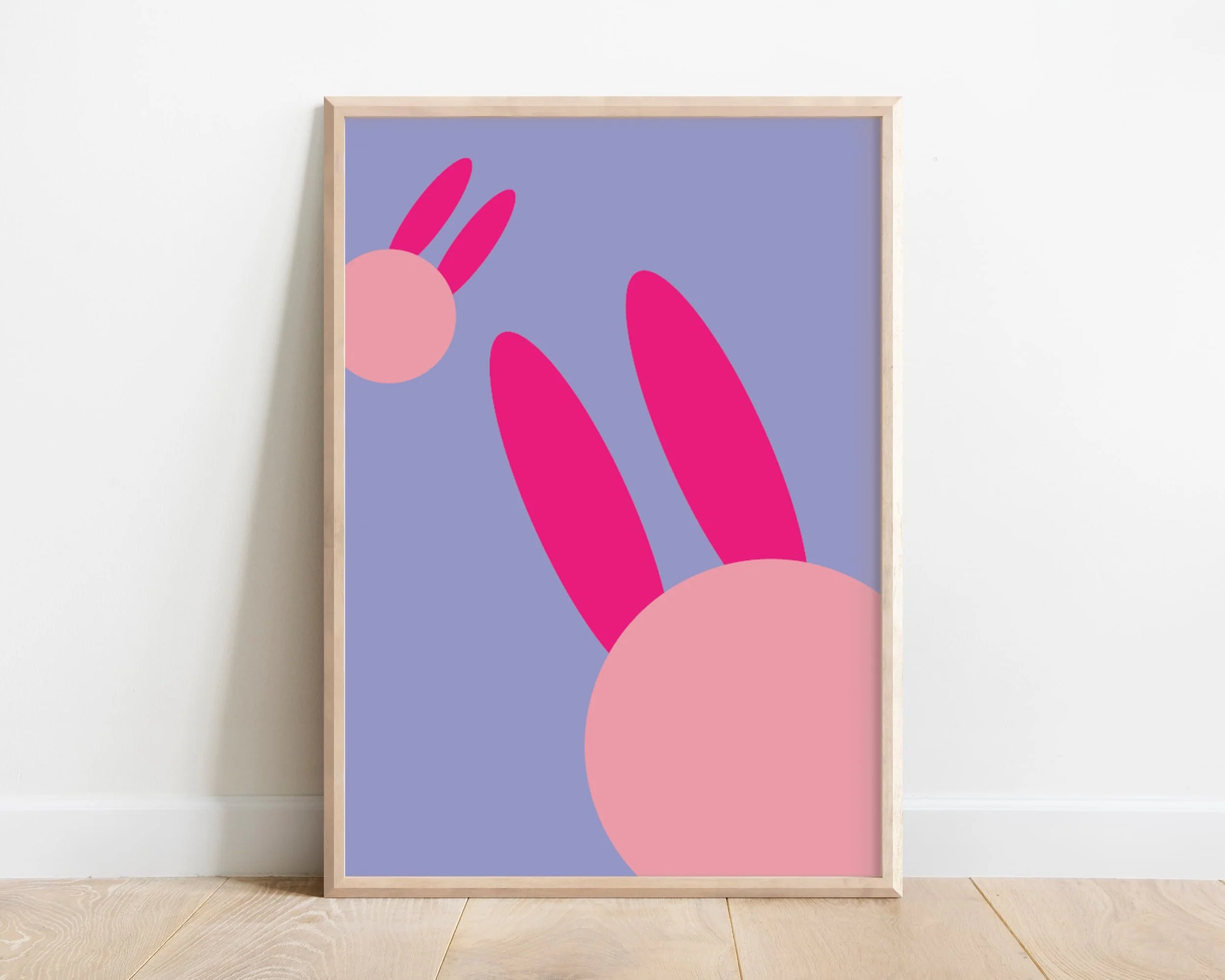 Framed abstract wall print of two purple bunny rabbits in a modern wooden frame – ideal for girls’ room or purple nursery decor, designed in the UK