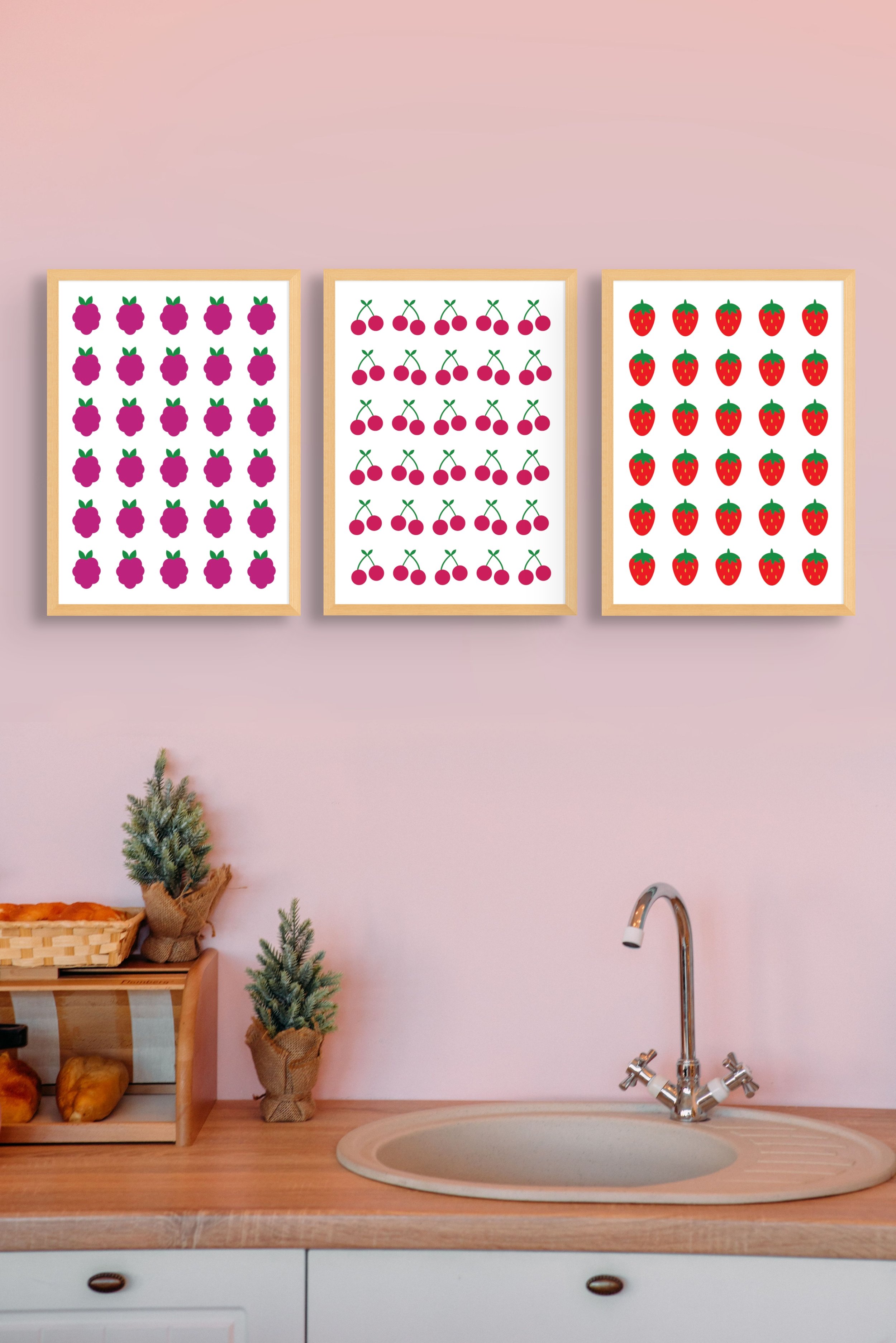 cute print set. three prints of fruit hanging on kitchen wall