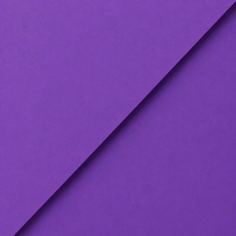 Close-up of overlapping purple paper with a diagonal crease.