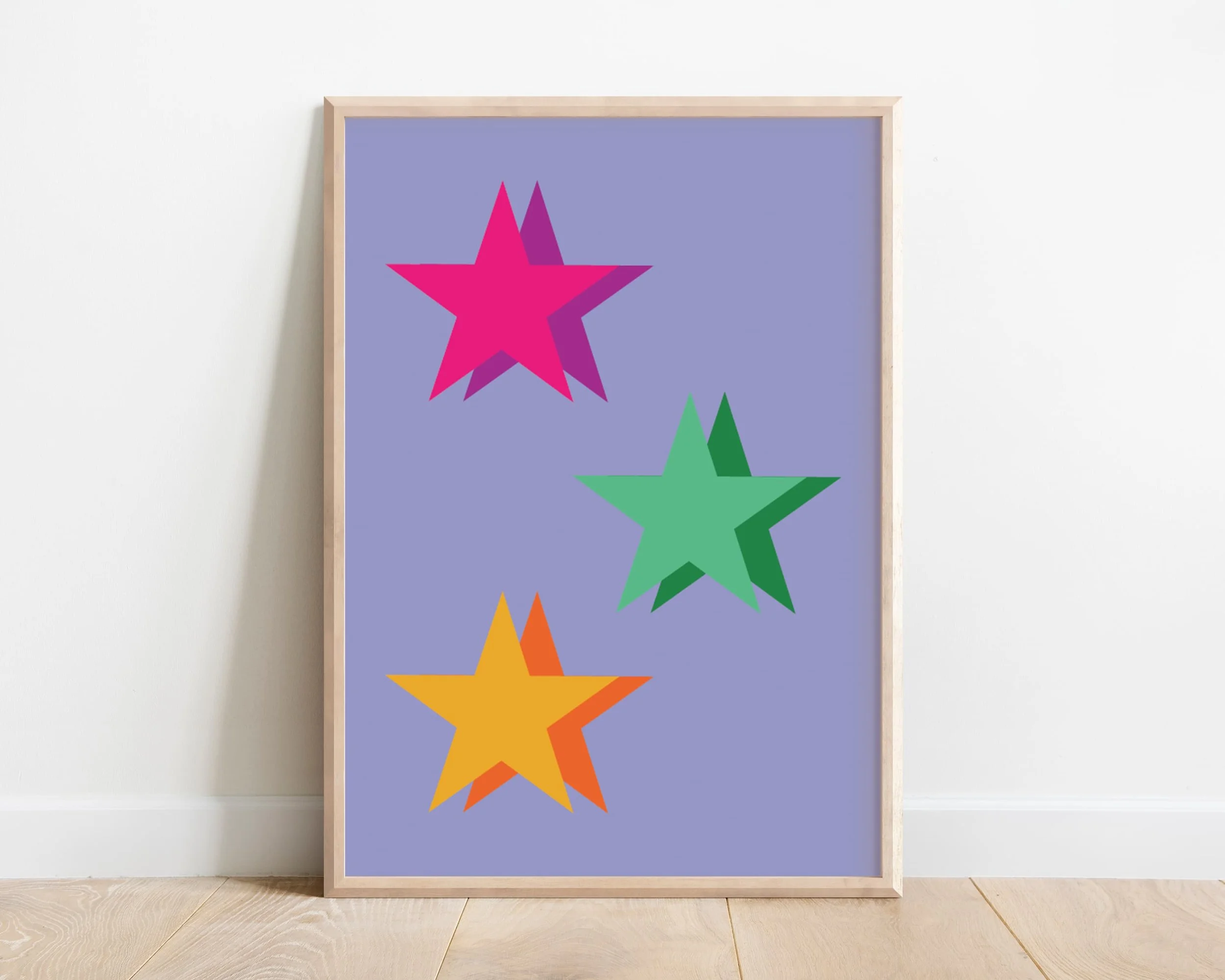 Colourful purple star wall art print with pink, green, and yellow tones, framed and styled in minimalist white interior decor