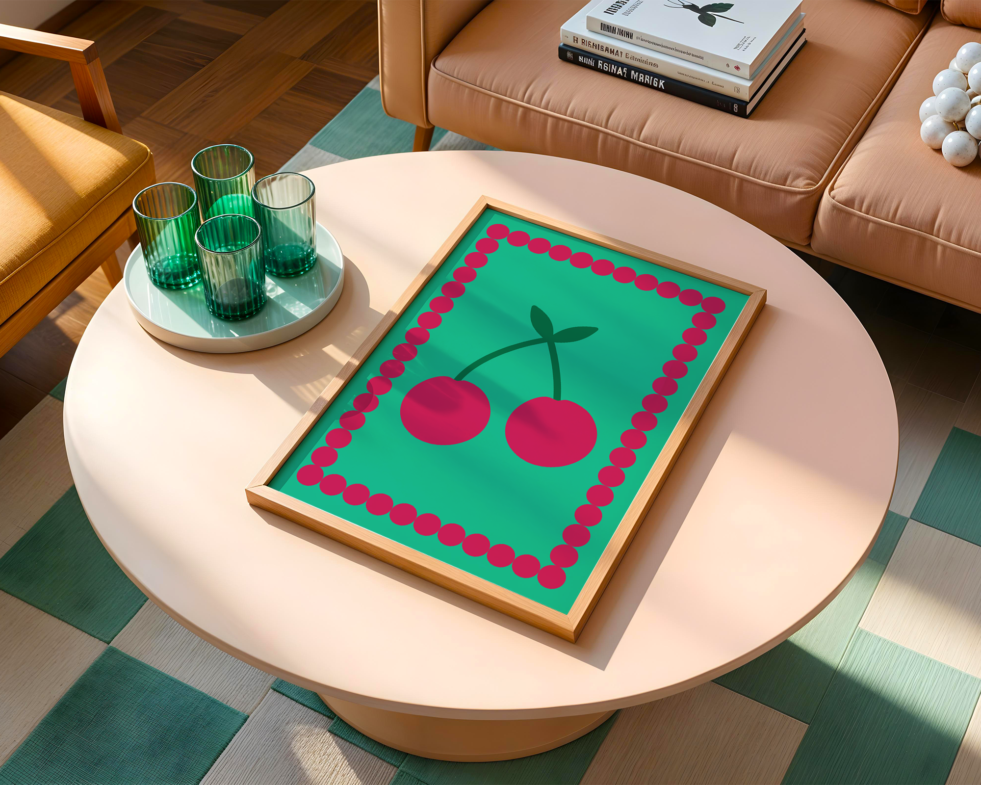 green cherry print on table next to glasses and sofa with books next to