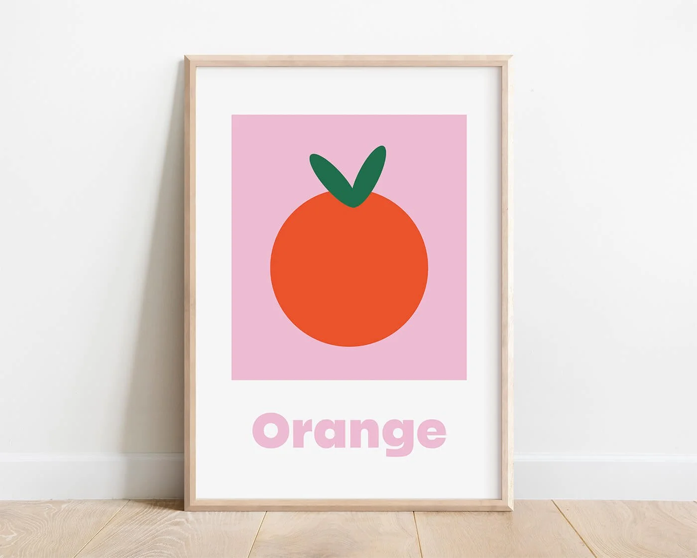 Orange Learning Print displayed in a contemporary solid wood frame against a white interior wall.